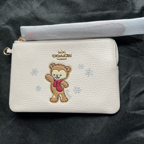 Coach Handbags - Coach Cream Colored Wristlet with Bear Motif BRAND NEW